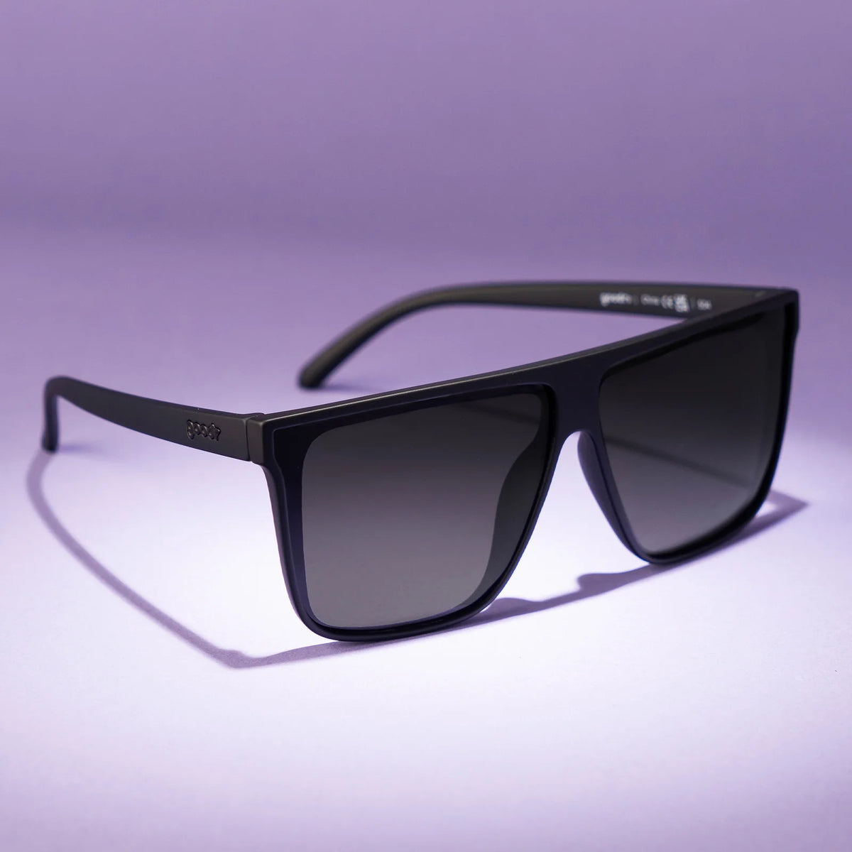 Black wide-fit, oversized sunglasses with non-reflective lenses. No slip, no bounce, all polarised.