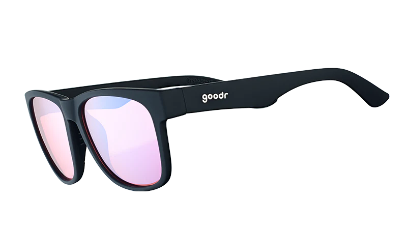 Product close up of large, square-framed black sunglasses with rose-tinted lenses.