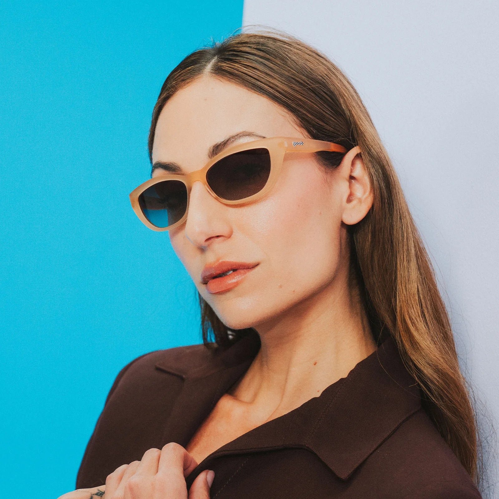 Translucent brown sunglasses in a cat-eye shape. Polarised brown gradient lenses with UV400 protection.
