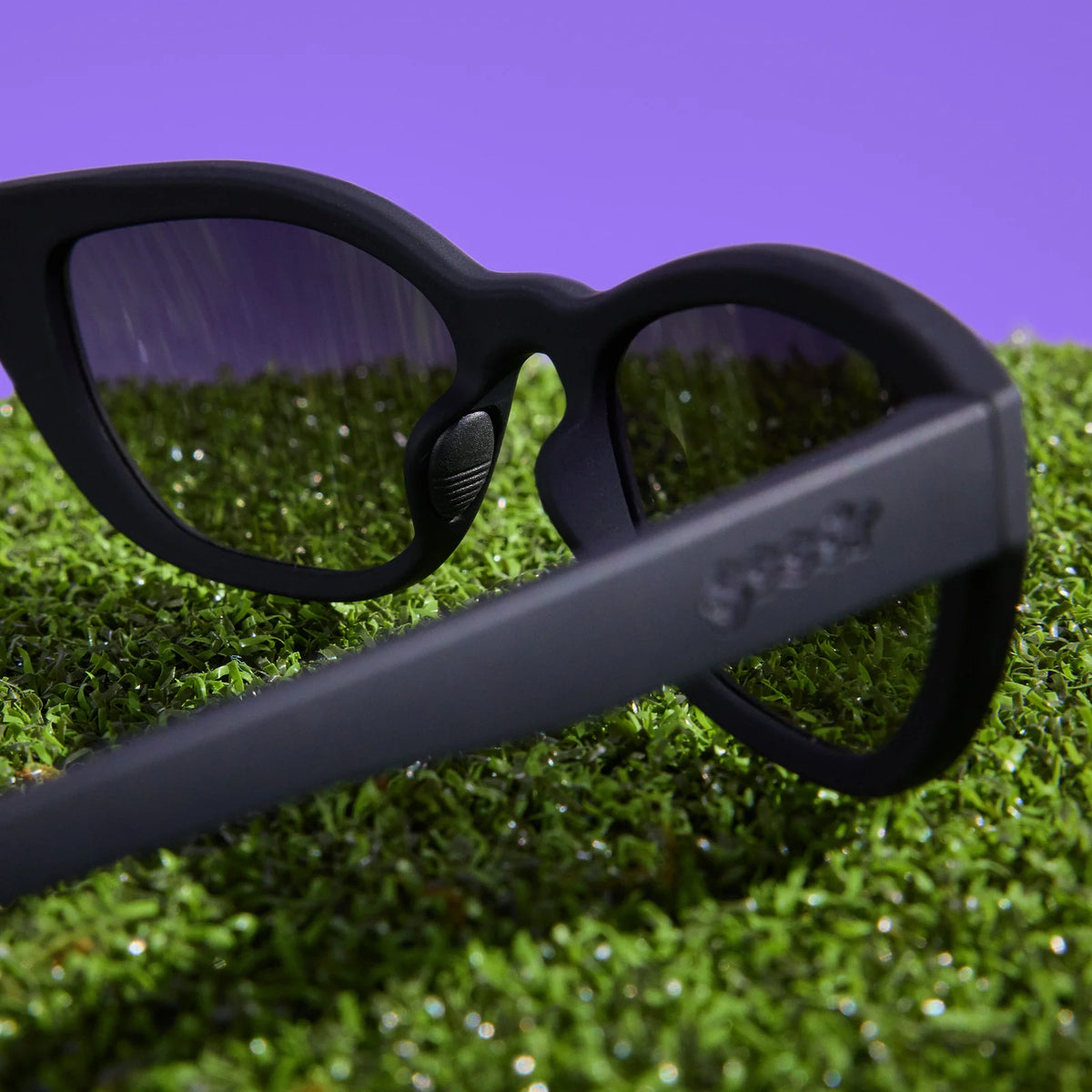 Black sunglasses with dark, gradient lenses. Simple and stylish cat-eye frames.